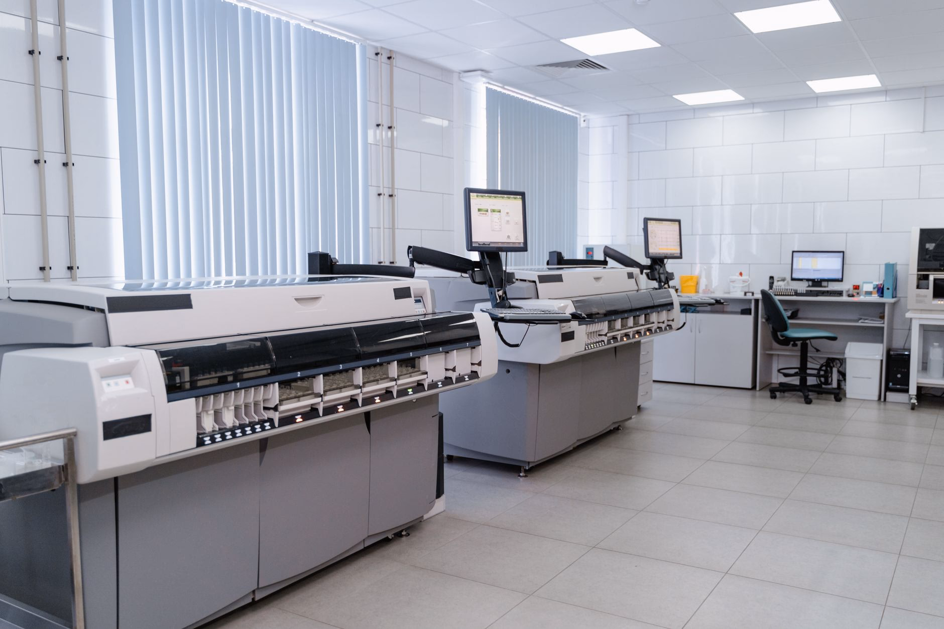 A modern science laboratory with analytical equipment and workstations