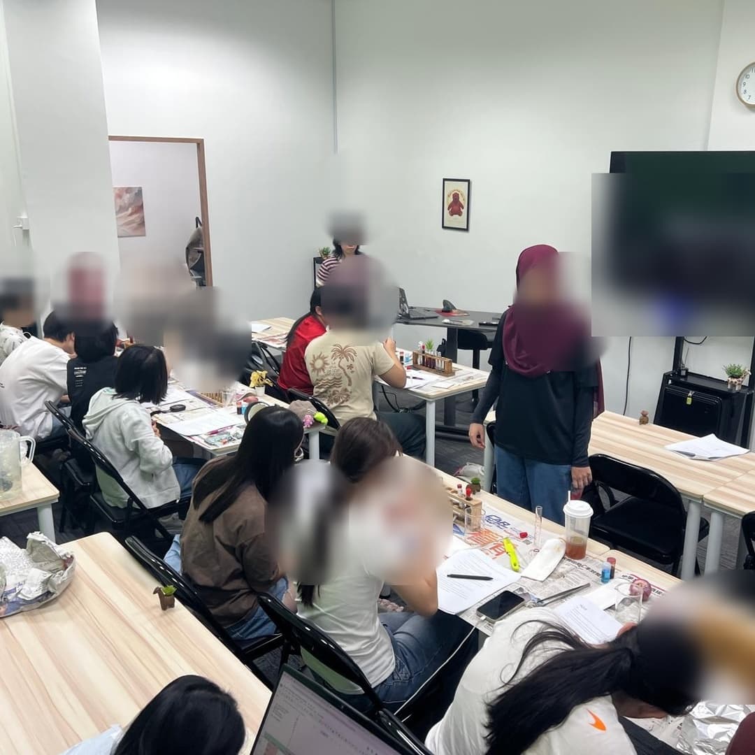 Anonymised O-Level Biology practical class in a full lab room